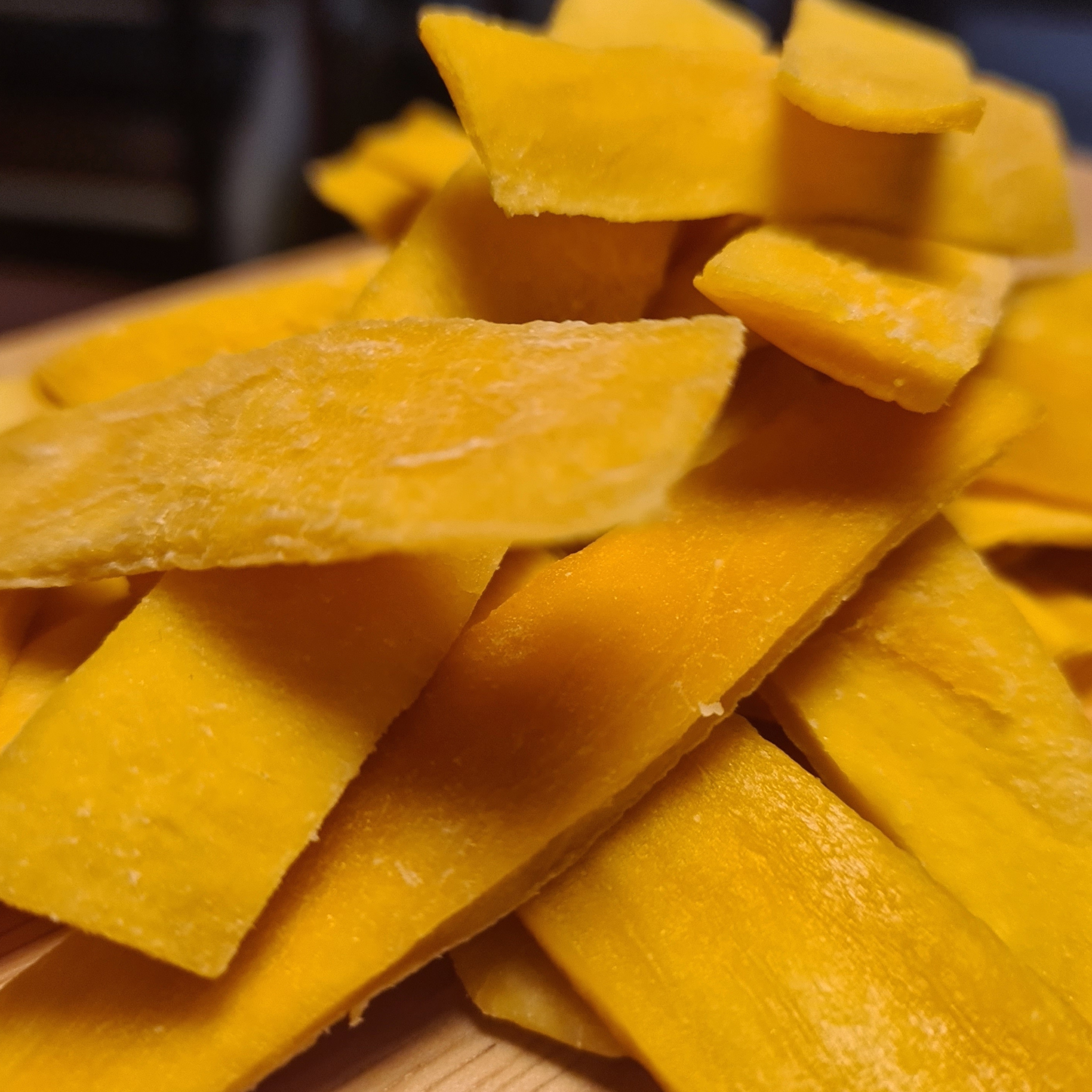 Vibrant yellow dried mango slices from Bar Necessities – tropical cocktail garnish for mixology, tiki drinks, and summer-themed bar menus
