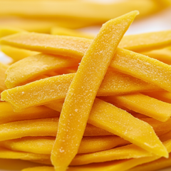 Close-up of yellow dried mango strands on a white background