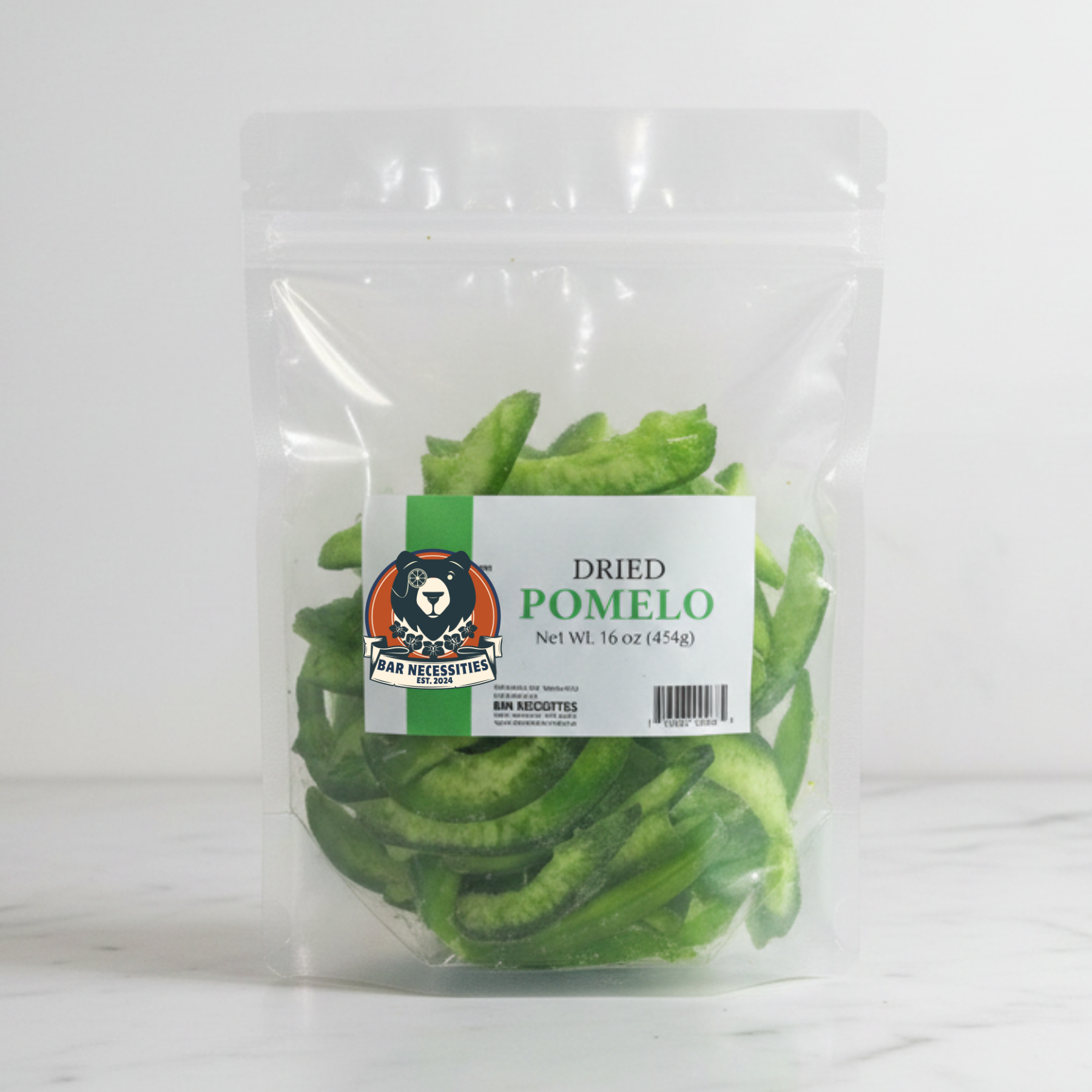 Packaged dried pomelo slices with a label on a white background