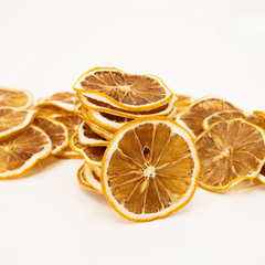 Stack of dried lemon slices on a white background