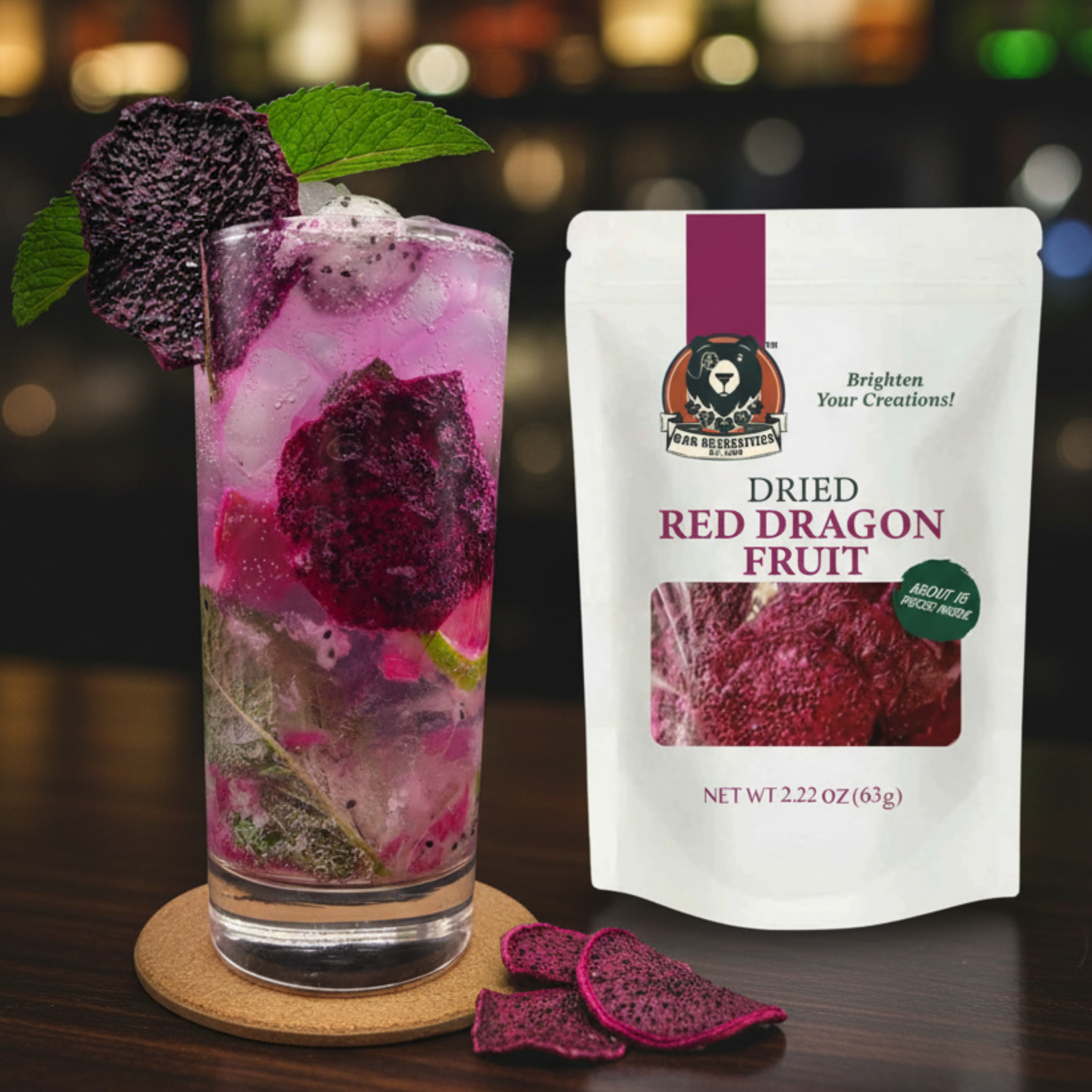 Glass of pink drink with dragon fruit pieces and a package of dried red dragon fruit on a dark background.
