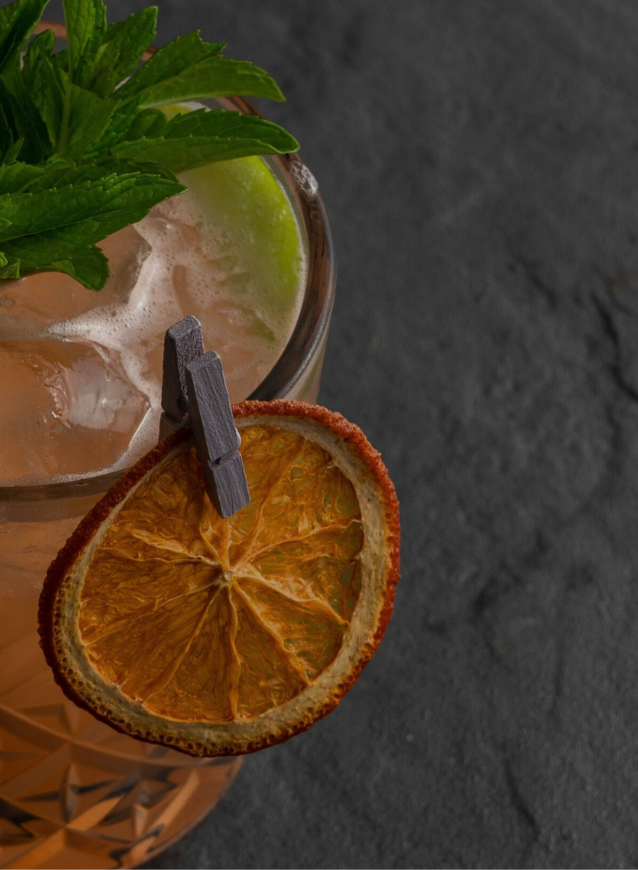 Crisp dried citrus slices used in mixology and gourmet dishes