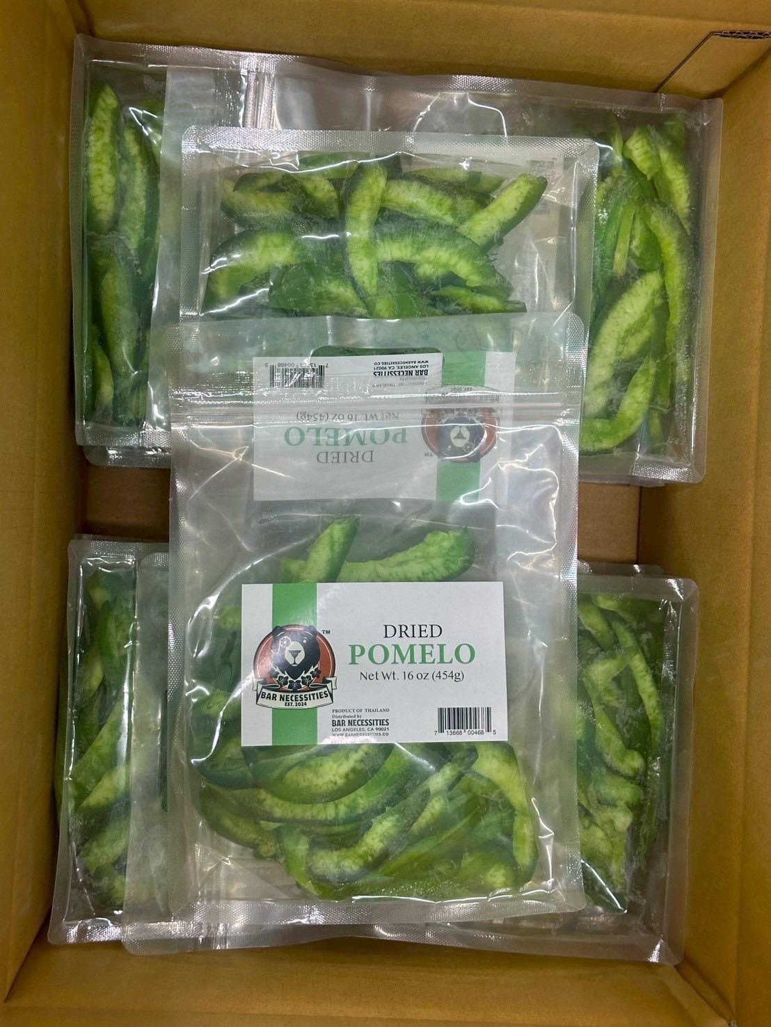 Box containing multiple packages of dried pomelo with visible branding and product labels.